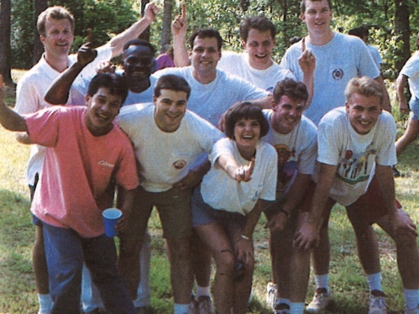 Group photo on field day in 90s (Dr. Mitchell pictured in the middle back with fingers up)