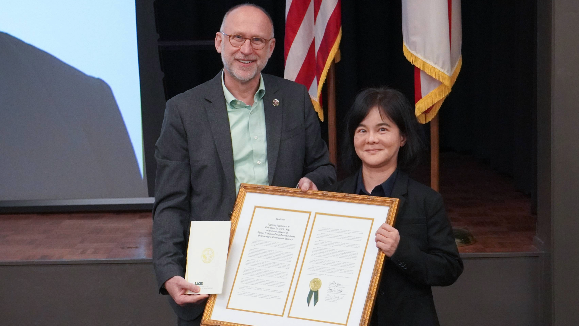 Dean Geurs and Dr. Fu receiving award at March EXCEL 2024