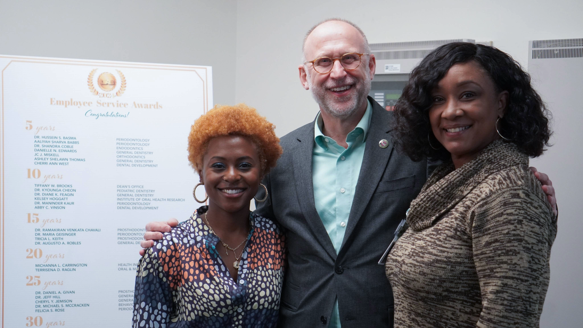 Dean Geurs with two service awardees at MArch EXCEL 2024