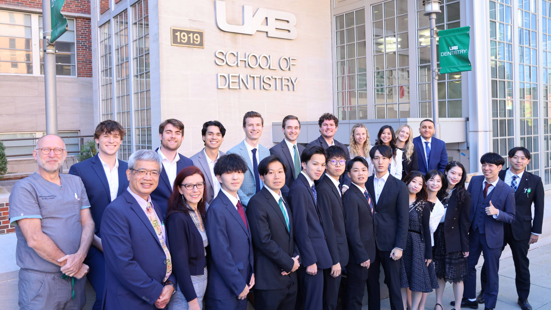 Group photo of Dean Geurs, UAB SOD students and faculty, and Japanese exchange students in 2024
