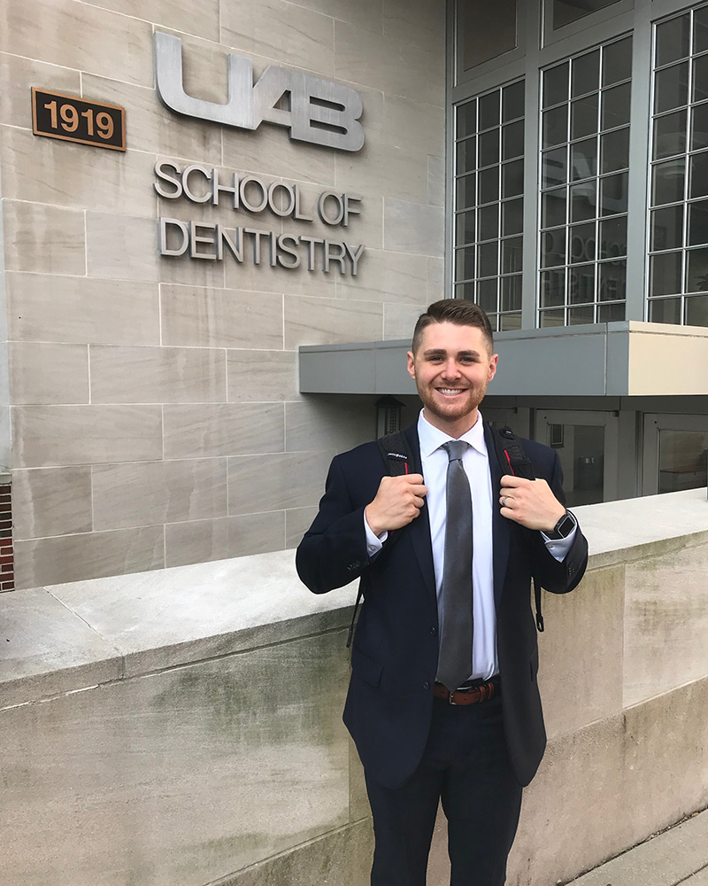 Steven Beard in front of the UAB School of Dentistry