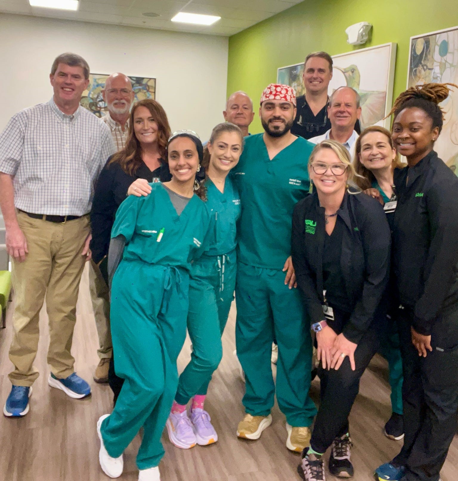 Dothan team with visiting dentists and rotating dental students