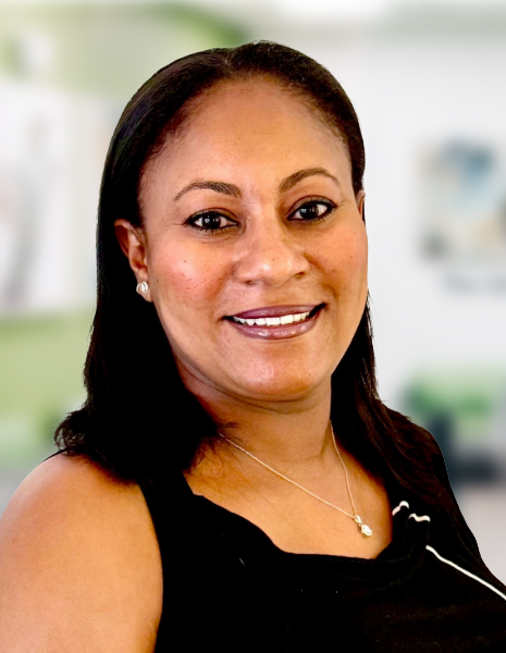 Smiling woman with dark hair and black top in colorful office setting