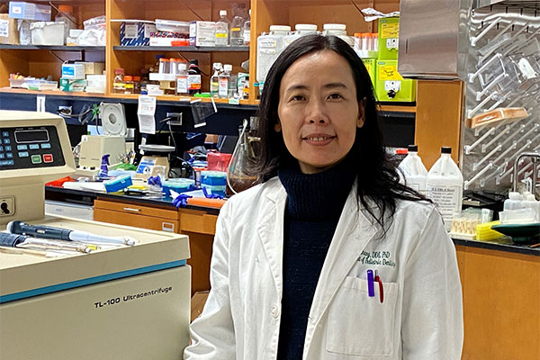 Dr. Ping Zhang posing for a photo in the lab.