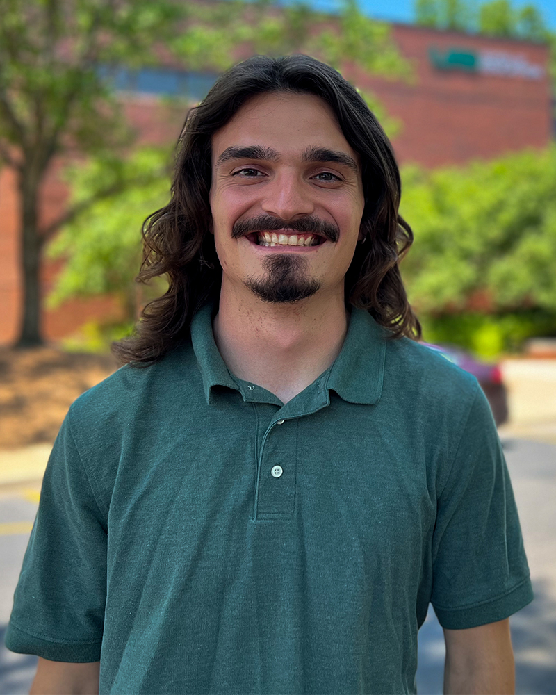 Kinesiology student, Leo Jacobs pictured in front of the Education and Engineering Complex on UAB's campus.