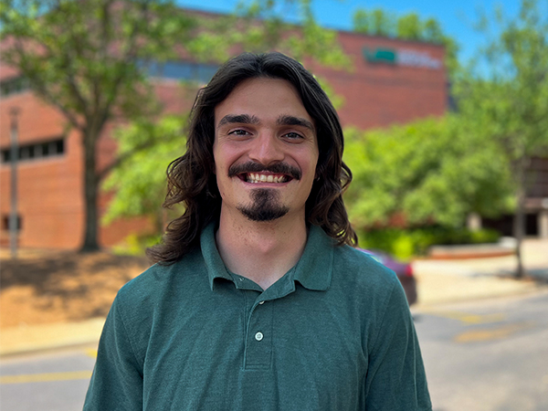 Kinesiology student, Leo Jacobs pictured in front of the Education and Engineering Complex on UAB's campus..