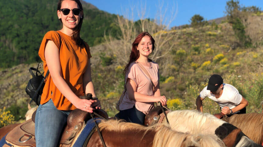 Courtney Severino and Riley Yager (IRES’19) are riding horses to the top of Mount Vesuvius, Italy. All IRES trainees receive unforgettable weekend adventures across Europe.