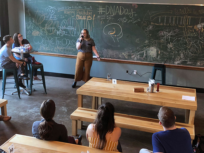 Bre Minniefield presenting to a crowd.