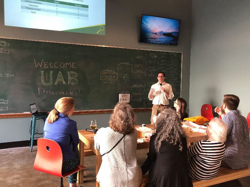 Alexander Hoffman presenting to a crowd.