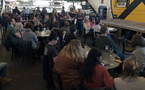 Audience listening to Catie Scull's lecture.