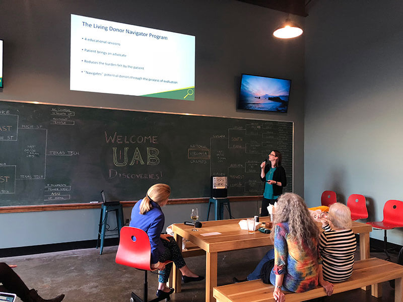 Rhiannon Reed presenting to a crowd.