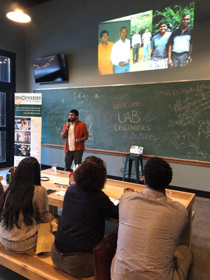 Sithira Ratnayaka presenting to a crowd.