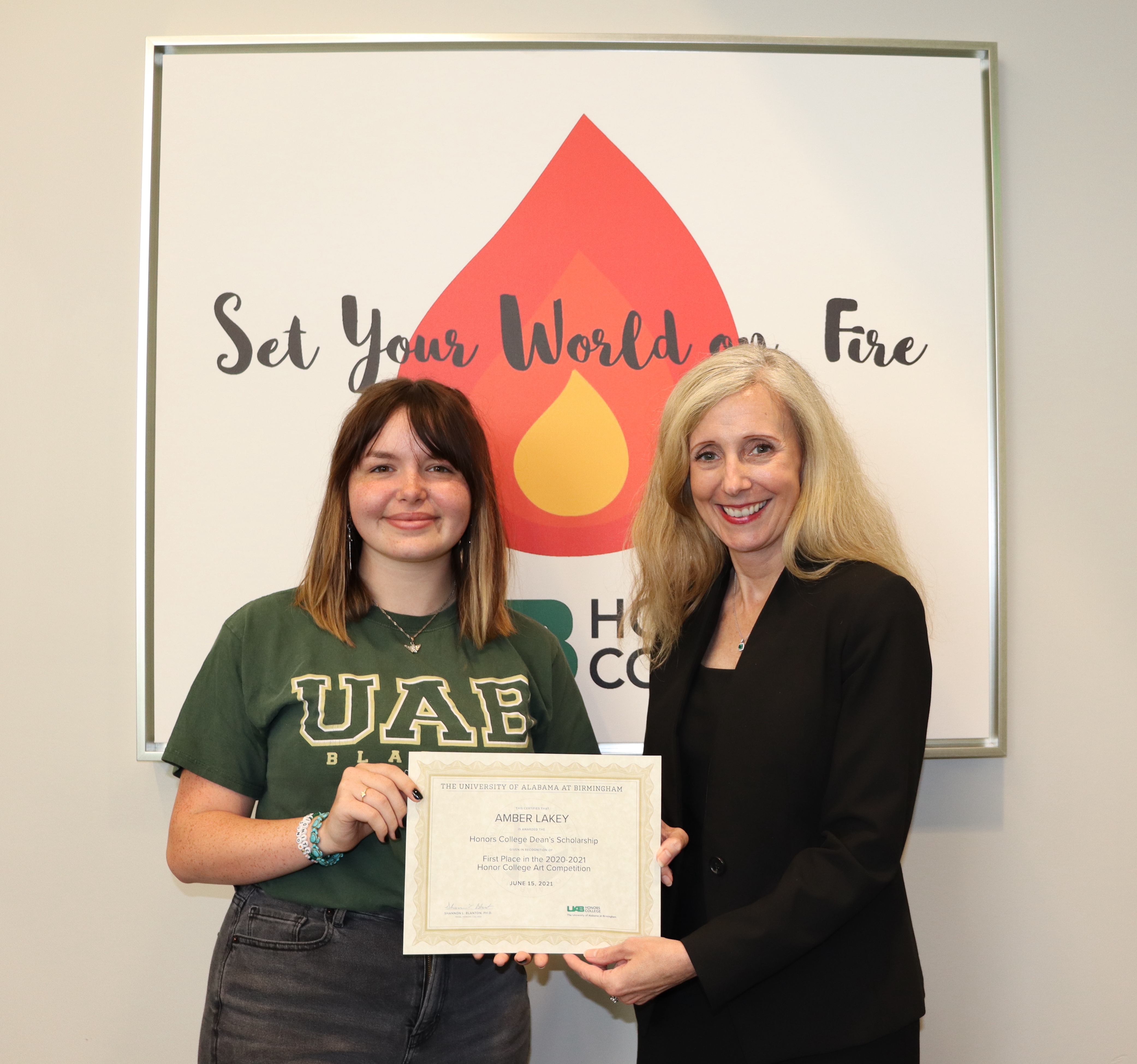 Dean Shannon L. Blanton and Amber Lakey with Honors College Art Contest Certificate