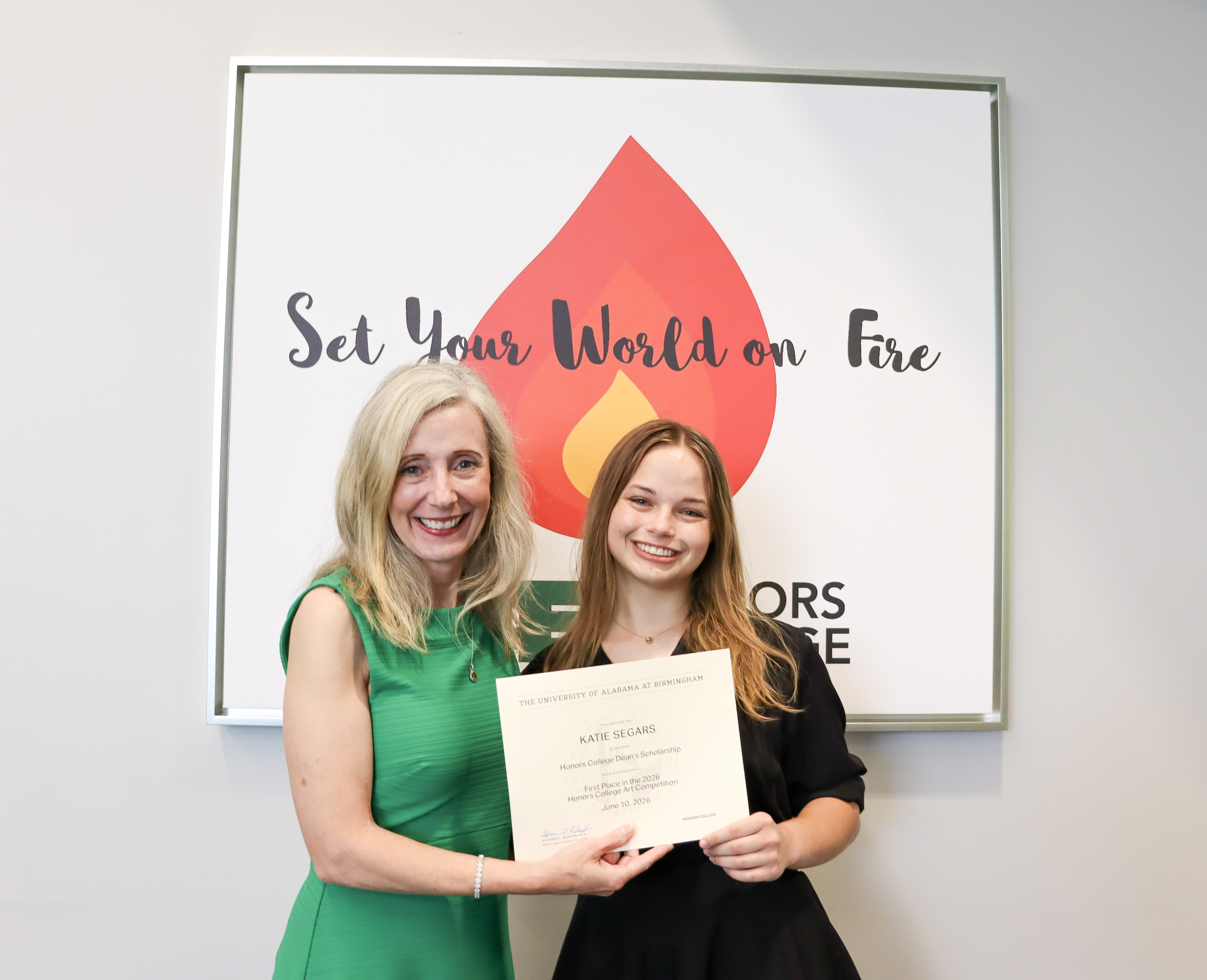 Dean Blanton presented Katie Segars with a certificate for the Dean's Scholarship Award