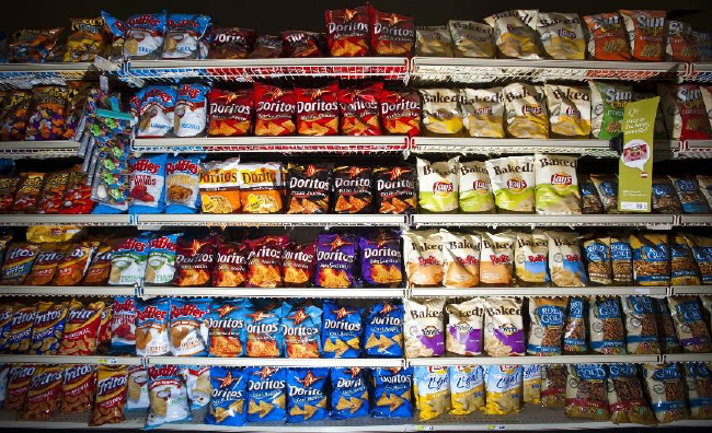 Aisle of chips displayed in a typical grocery store