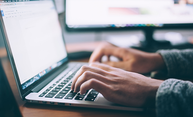 Hands on a laptop