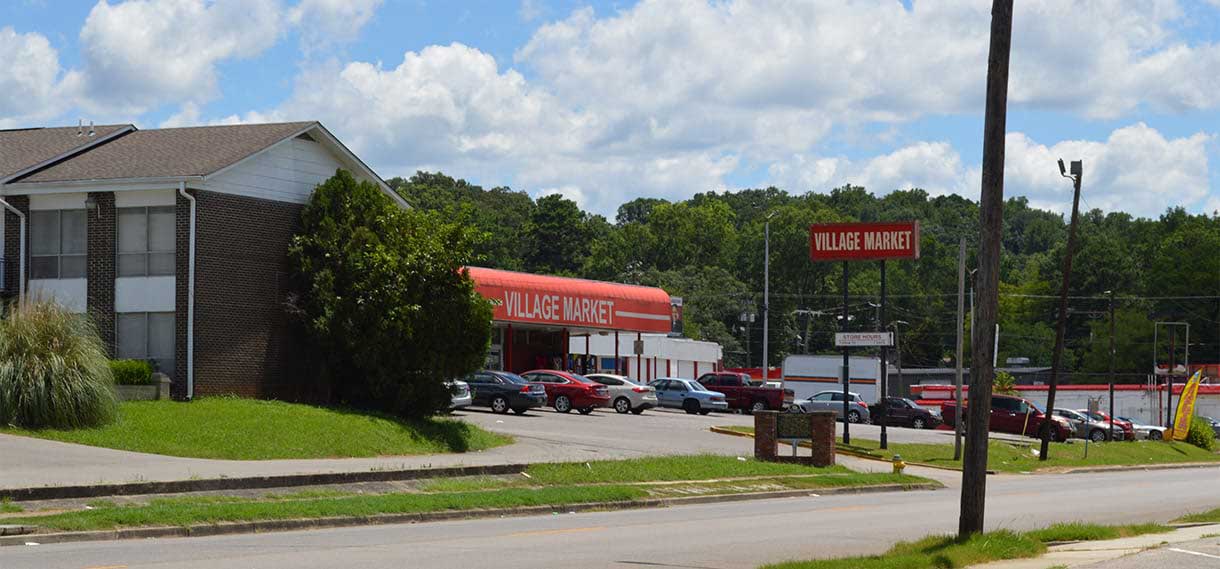 The Village Market and an apartment complex.