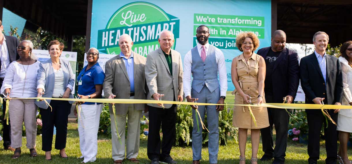 President Watts, Mayor Woodfin, and others at the Live Healthsmart ribbon-cutting ceremony.