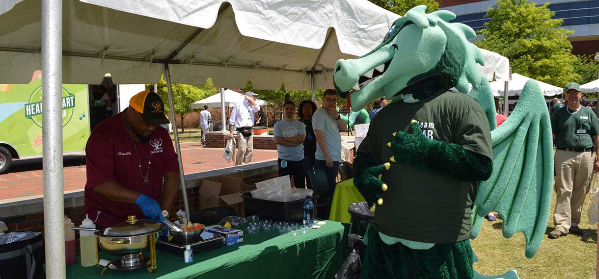 Blaze rubs his tummy in anticipation while watching a cooking demonstration.