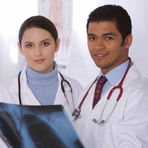 Photo of two physicians looking at x-ray