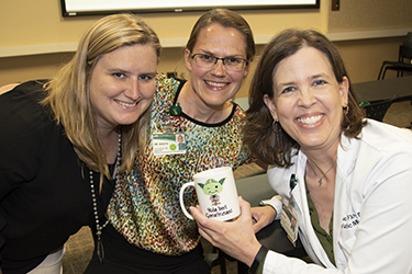 Emily Simmons, RN, Katrina Booth, MD, and Kellie Flood, MD