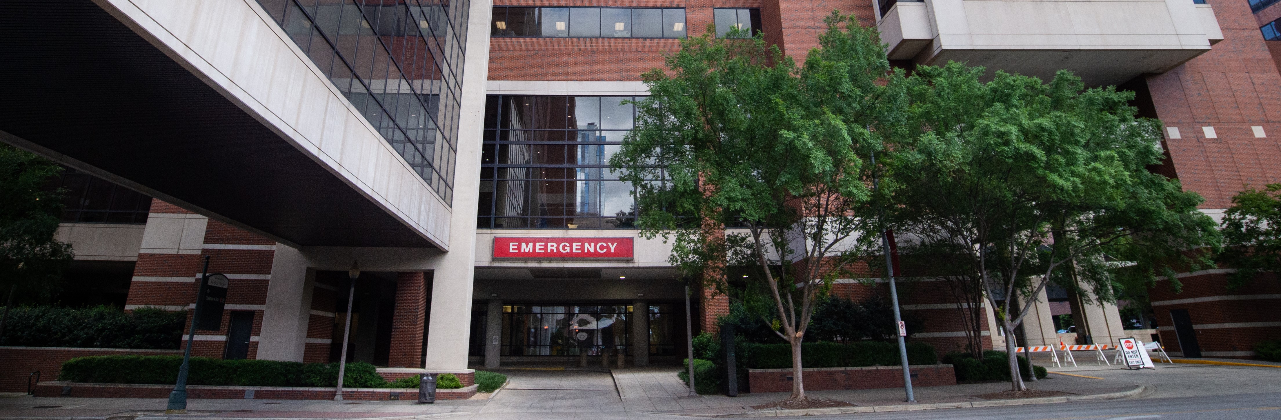 Exterior of the Emergency Department in the North Pavilion of UAB Hospital showing the "Emergency" sign, April 2020.