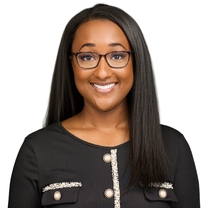 Woman in black blazer and glasses