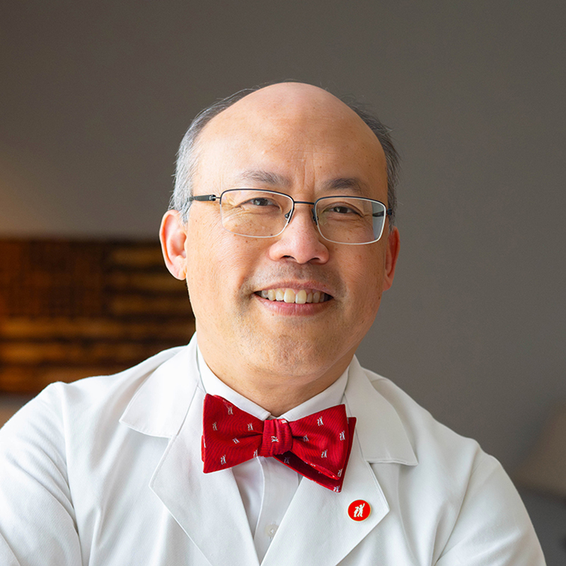headshot of Dr. Lau.