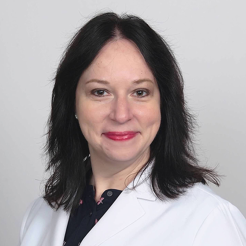 headshot of Dr. Muzny.