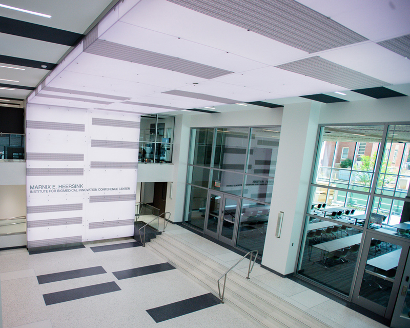 Exterior entrance to the Heersink Institute for Biomedical Innovation Conference Center showing wall signage.