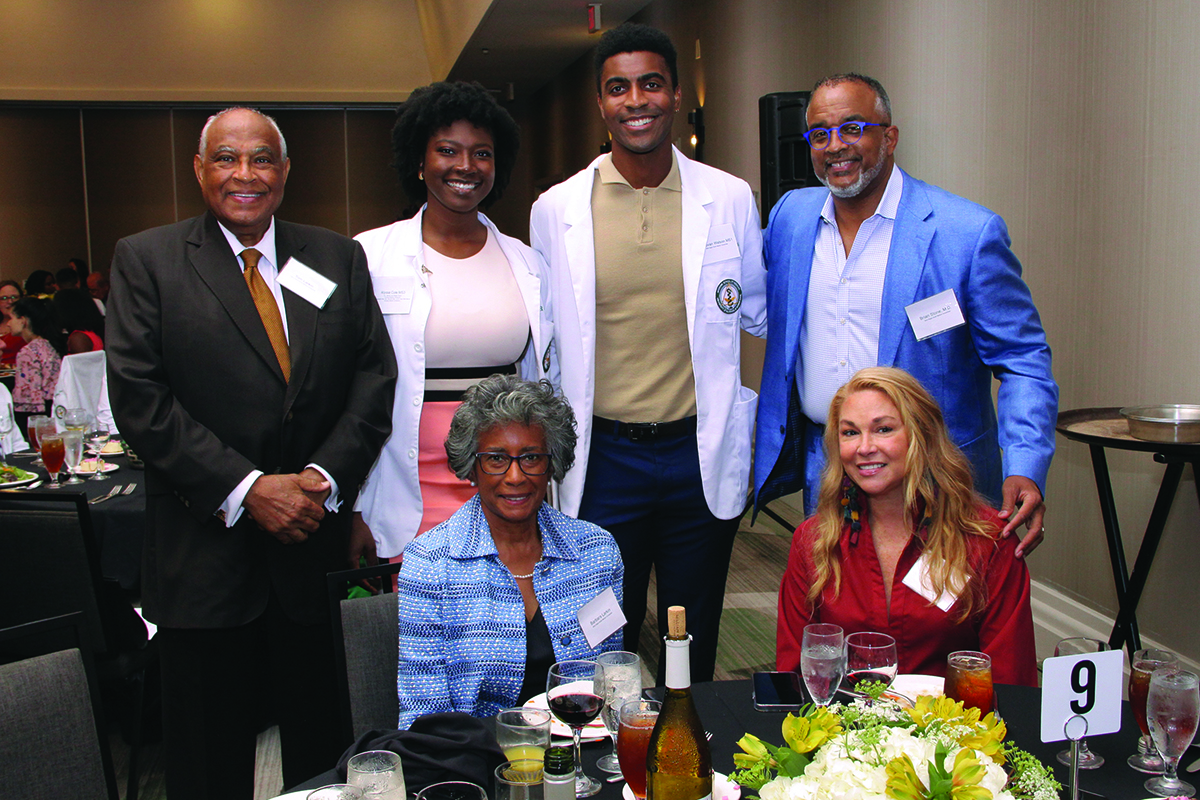 Supporters of the Beta Kappa Boulé Medical Scholarship with recipient Donovan Watson (back row, second from white) and scholarship recipient Alyssa Cole (second from left) at the 2022 Scholarship Dinner. 