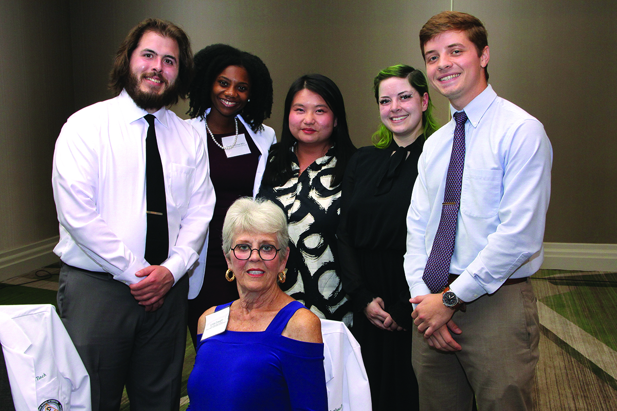 Linda Draughn with Burleson scholarship recipients at the 2022 Scholarship Dinner.