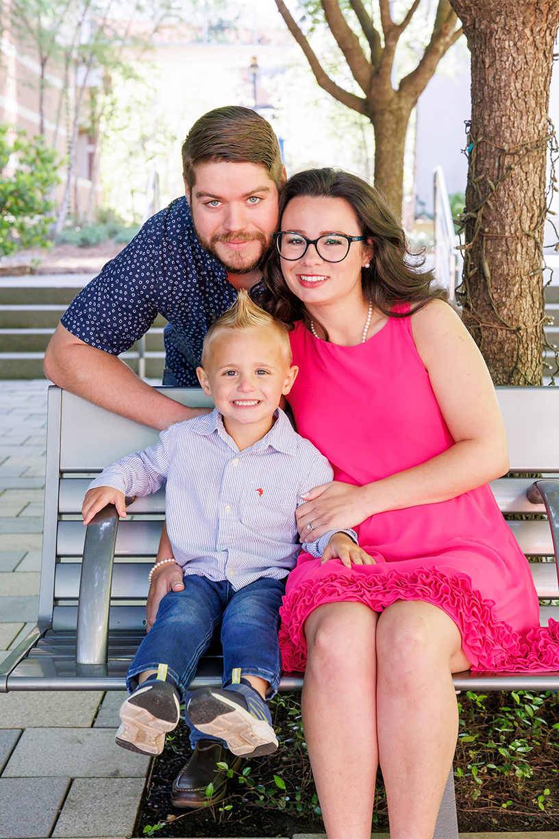Cathryn, Cameron and Lincoln Cazalas on a bench outdoors