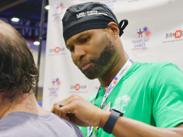 Calvin Spellmon MD cares for an athlete's shoulder