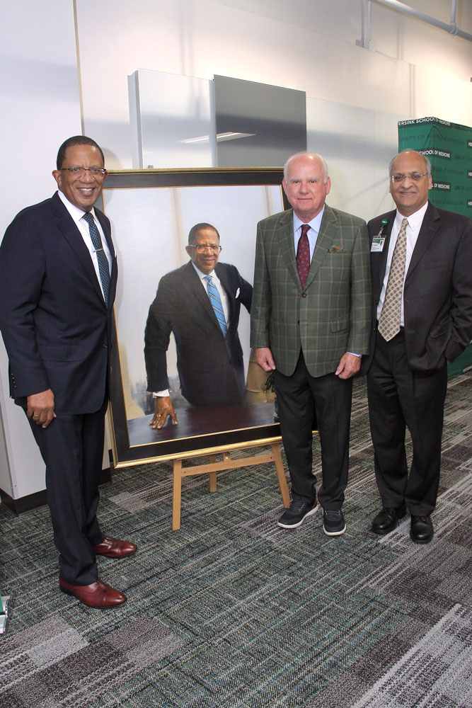 Drs. Selwyn Vickers, Ray Watts, and Anupam Agarwal with Vickers' official portrait