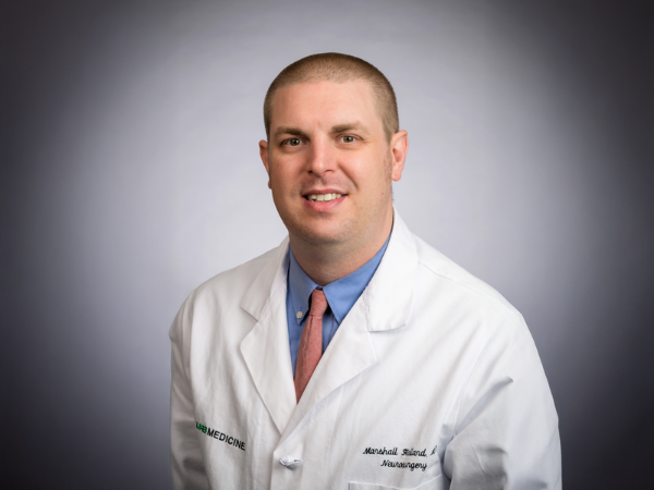 Holland promoted to associate professor