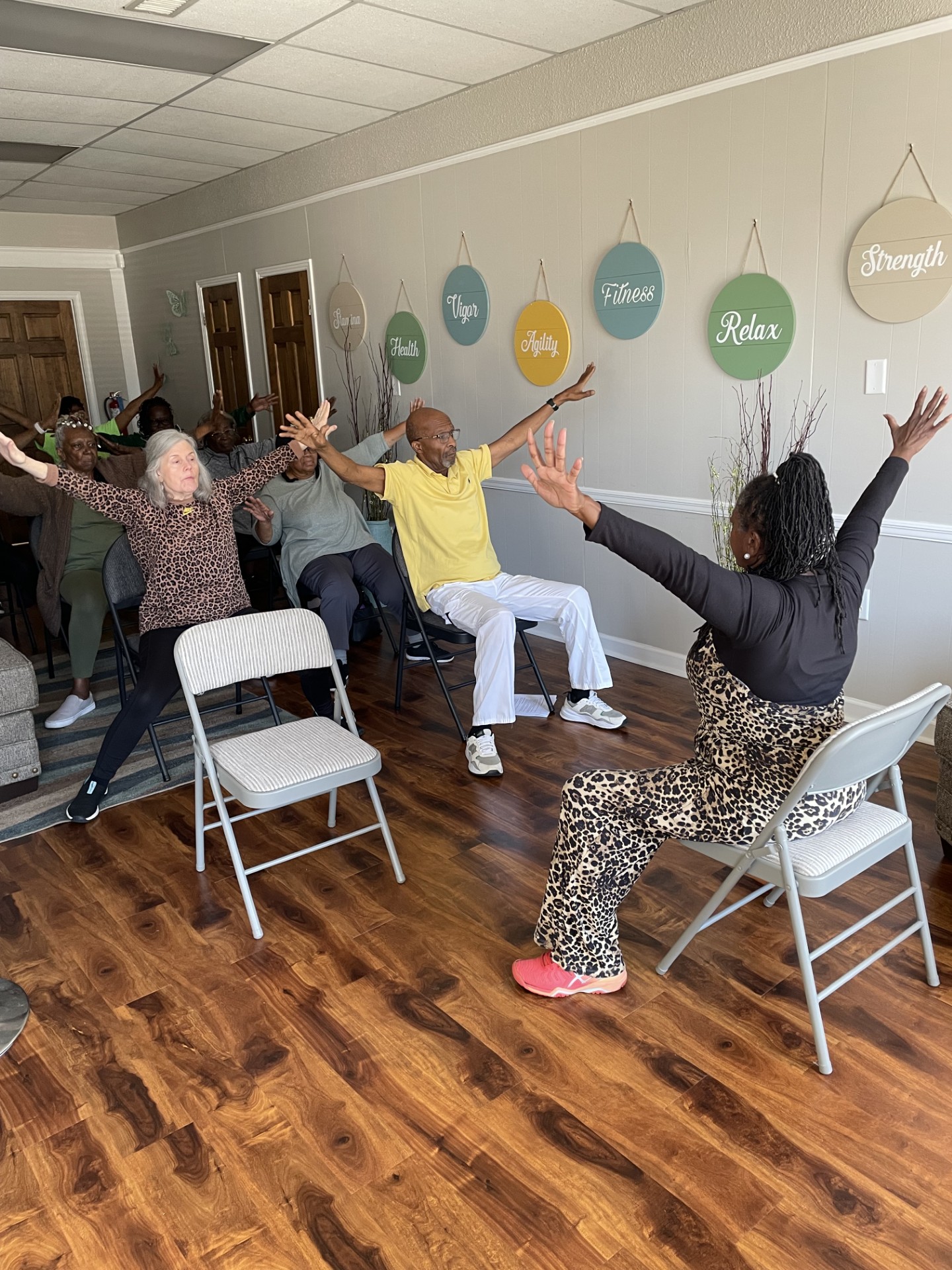 Selma residents participating in seated yoga