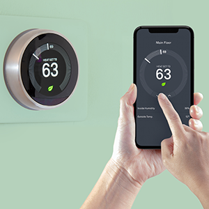 Person adjusting thermostat temperature on smartphone