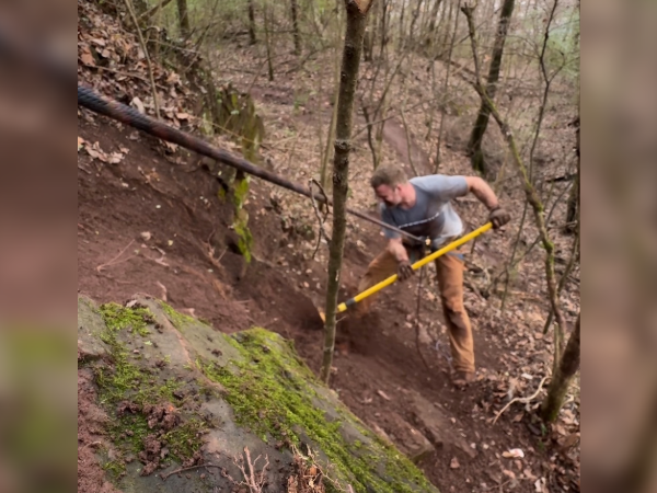Dr. Withrow building a trail