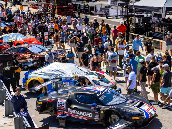 crowd of people viewing a lineup of racecars at Barber Motor Speedway