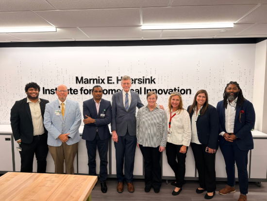 A group photo with Marnix E. Heersink, M.D., MHIBI staff, and the Heersink AI Founders. 