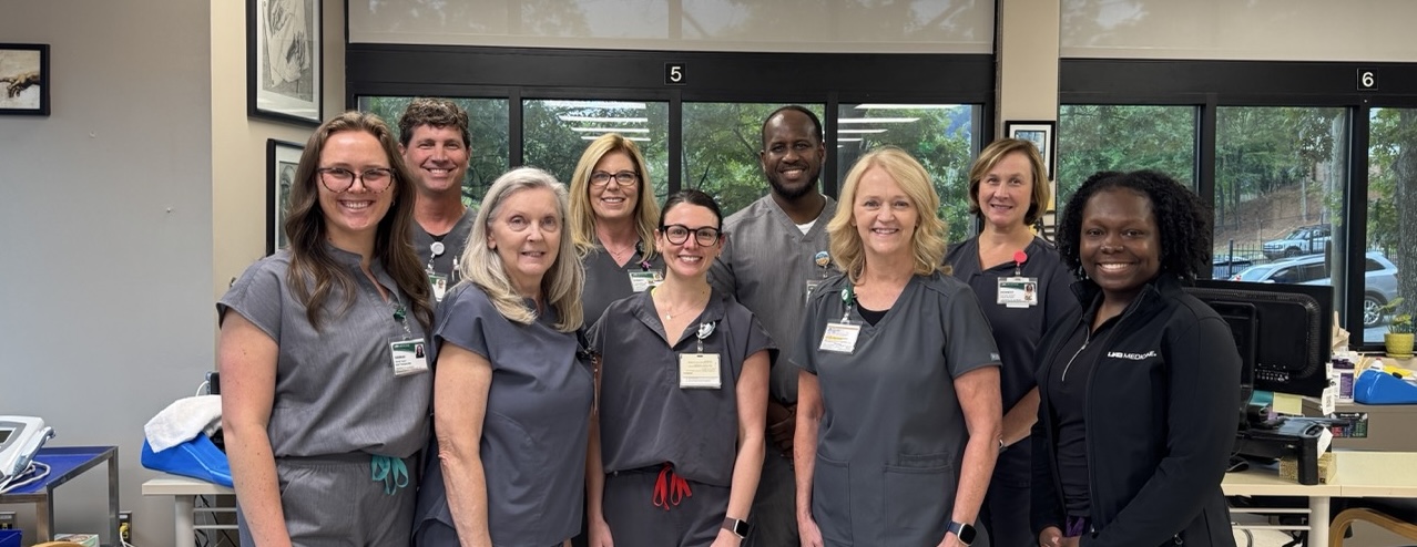 Hand Therapy team members pose together in a clinic.