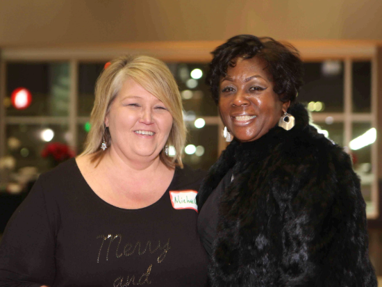 Michelle Thrasher and a friend at a holiday party
