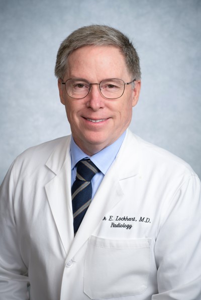 Dr. Lockhart headshot in white coat and tie