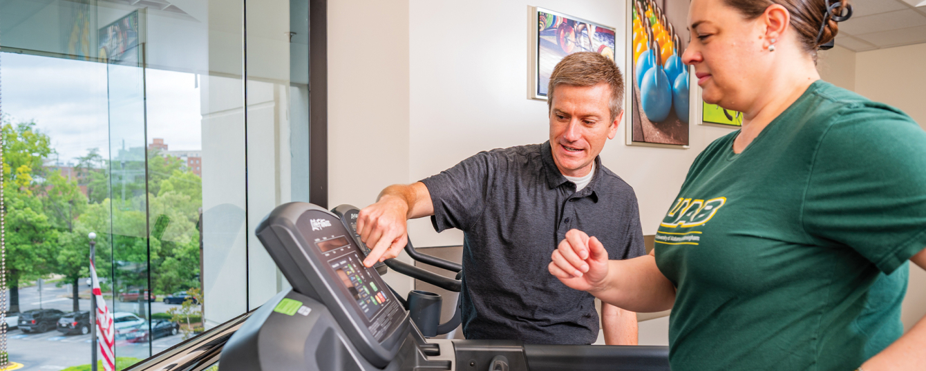 A specialist conducts a treadmill test on a patient in the UAB Sports and Exercise Medicine Clinic.