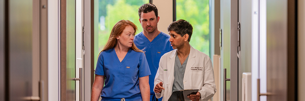 Sports Medicine Section faculty walking down hallway
