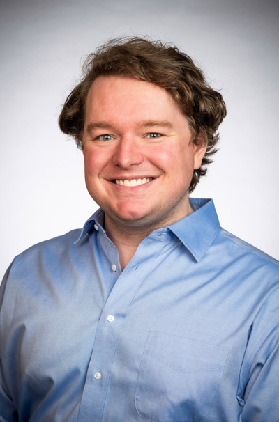 headshot of John West