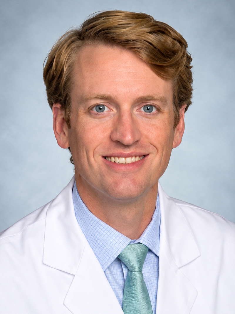 Headshot of Adam Jacobs.