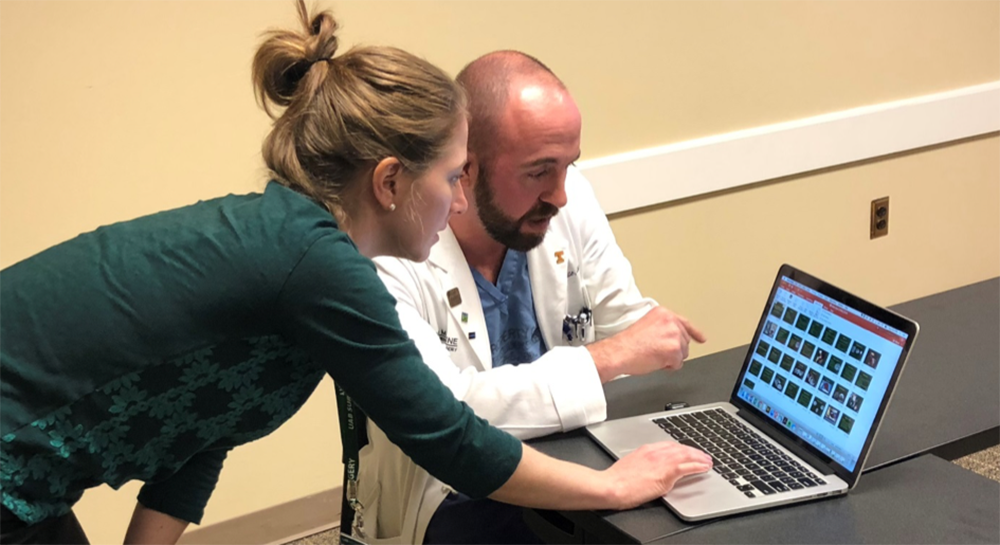 UAB Department of Surgery Communications Director Megan Yeatts works with Assistant Professor of Transplantation Jared White, M.D., to record his presentation.