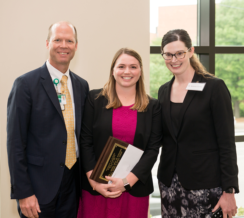 Dr. Richard Stahl (left) and Dr. Britney Corey (right) present Mary Smithson with both 2018 Department of Surgery medical student awards at the May 18 UAB School of Medicine Birmingham campus awards' luncheon at the UAB National Alumni Society House. (Photo by Dustin Massey)